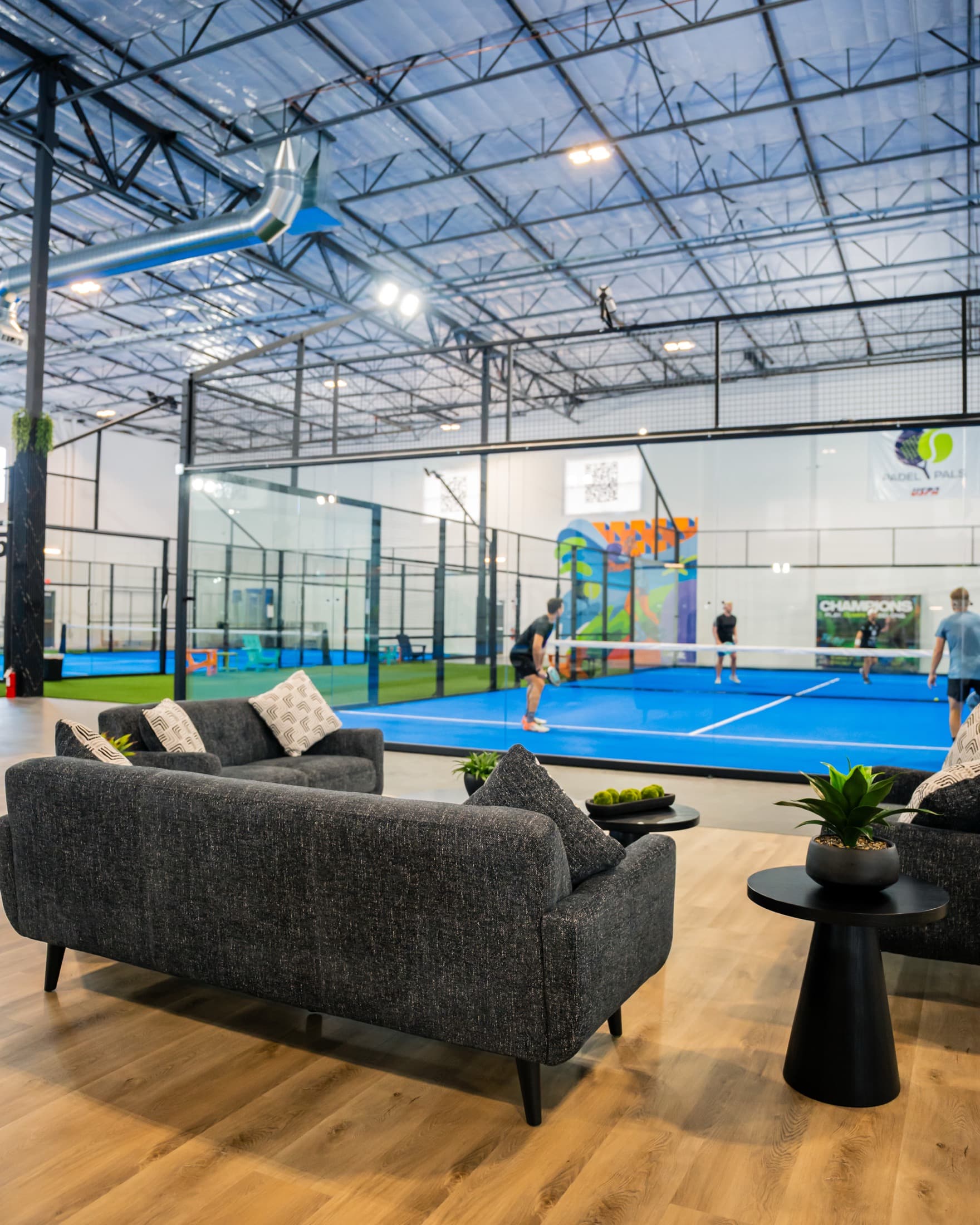 Padel Pals lounge seating beside the indoor courts