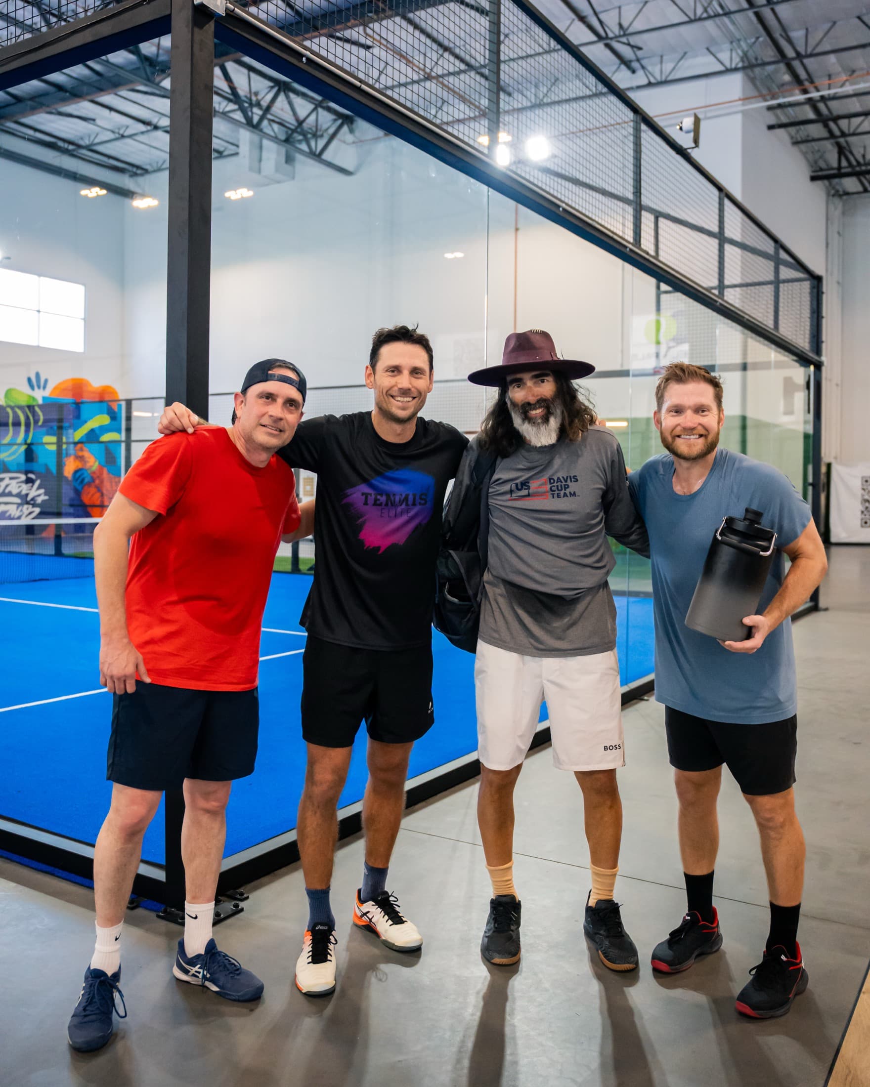 Padel Pals players smiling together after an indoor match